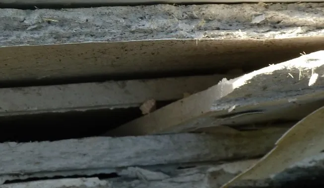 Stacked asbestos insulating board (AIB) sheets