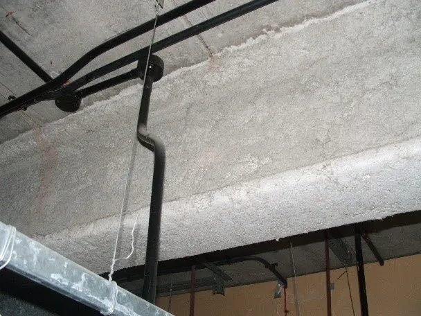 Asbestos lagging splash on a boiler room wall