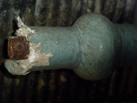Damaged asbestos thermal pipe lagging