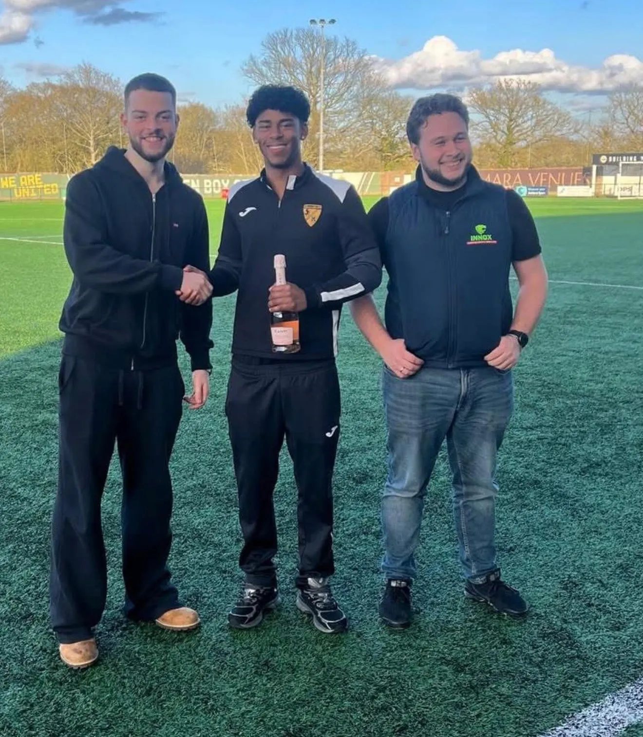 INNOX presenting a man-of-the-match award at a local football club